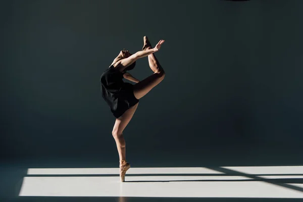 Beautiful young ballerina dancing in sunlight — Stock Photo