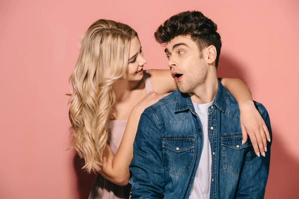 Smiling girlfriend and handsome boyfriend in denim shirt hugging and looking at each other — Stock Photo