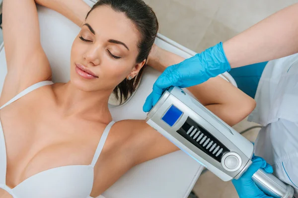 Cropped view of cosmetologist doing  therapy for arm — Stock Photo