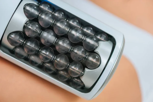 Close up view of roller on female body - foto de stock