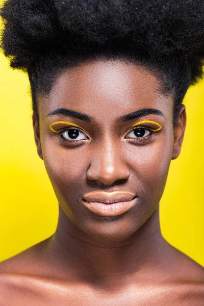 Front view of cheerful african american woman isolated on yellow — Stock Photo
