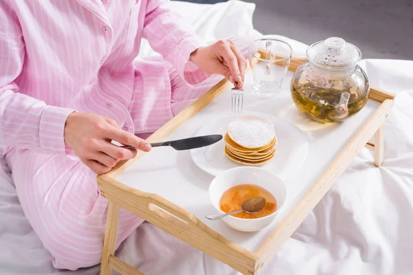 Partial View Woman Pajamas Having Pancakes Jam Breakfast Bed Home — Free Stock Photo