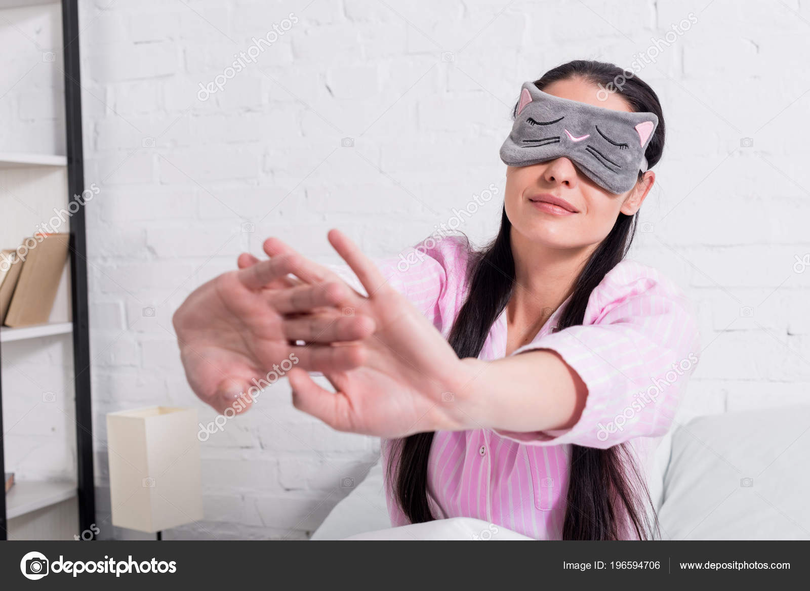 Sleepy Woman With Blindfolds On Eyes Stretching Stock Photo