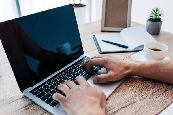 Partial View Man Typing Laptop Table Coffee Cup Textbook Photo — Stock Photo, Image