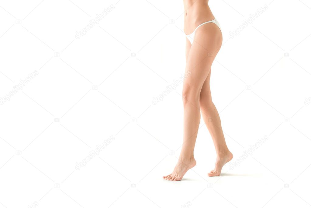 cropped view of beautiful girl posing in white bikini, isolated on white with copy space