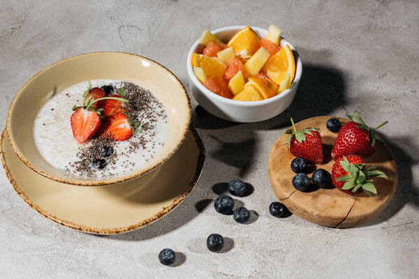 Healthy breakfast with chia seeds bowl and ripe fruits