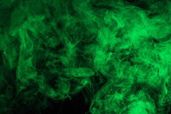 abstract background with green smoke on black 