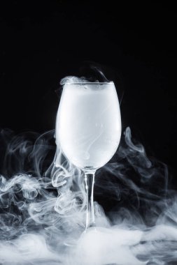 white smoke in glass on black background clipart