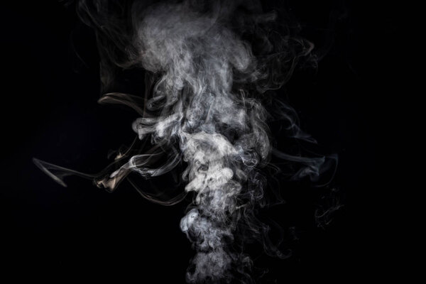 grey smoky swirl from cigarette on black