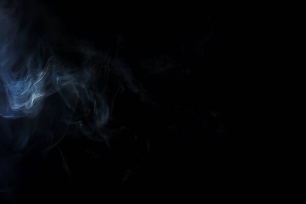 Background with white spiritual smoke on black