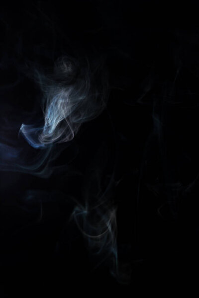 White spiritual smoke on black background