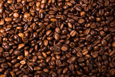 full frame shot of freshly roasted coffee beans clipart