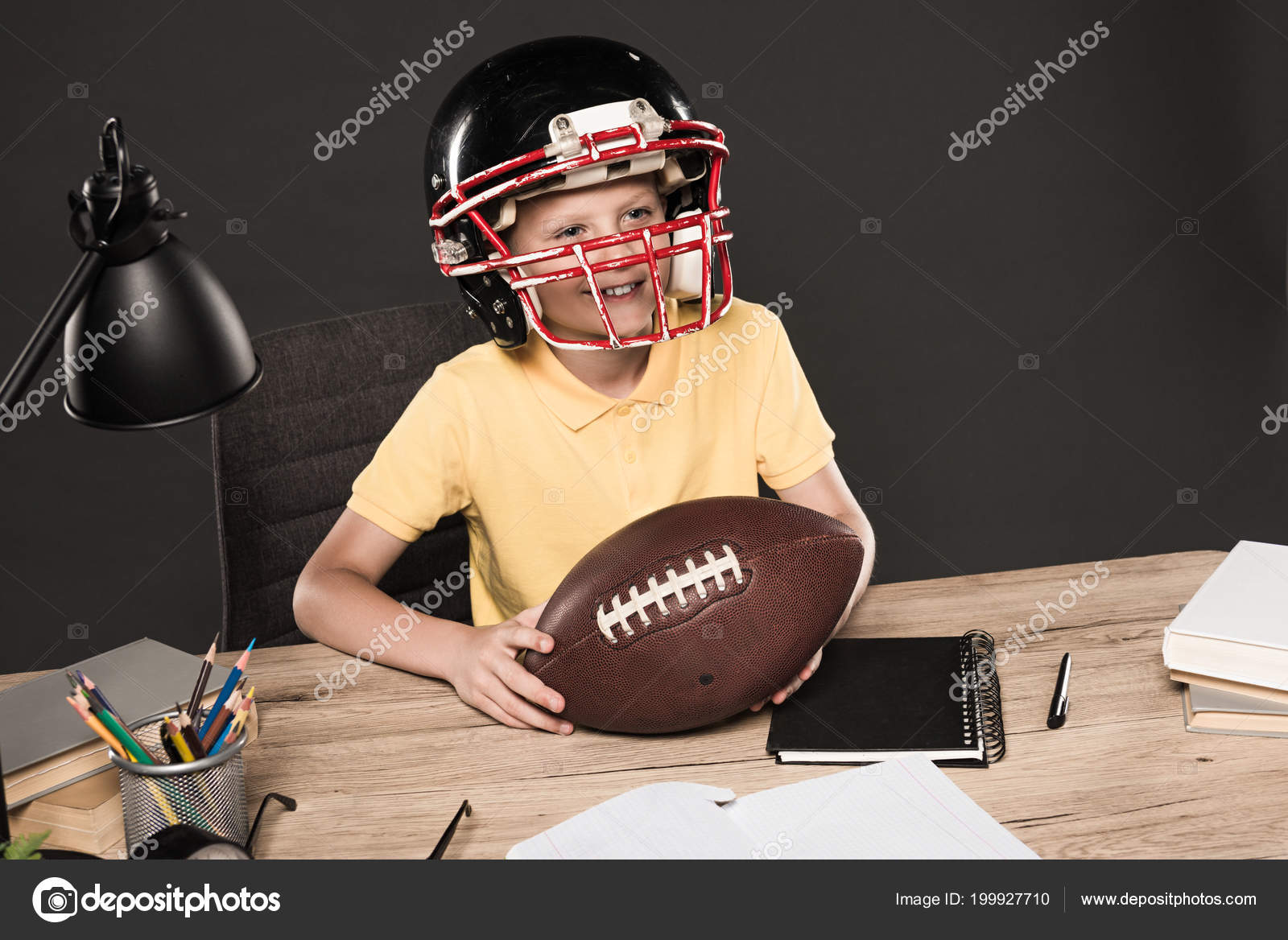 Adorable American Football Helmet Sitting Table Ball Books Adorable American Football Helmet Sitting Table Ball Books Lamp Stock Photo