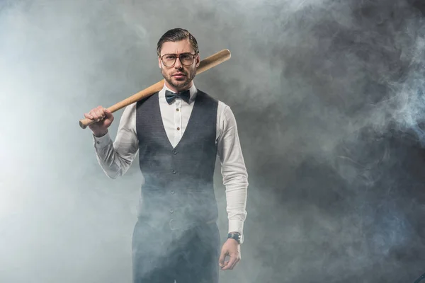 Stylish Man Bow Tie Eyeglasses Holding Baseball Bat Looking Camera — Free Stock Photo