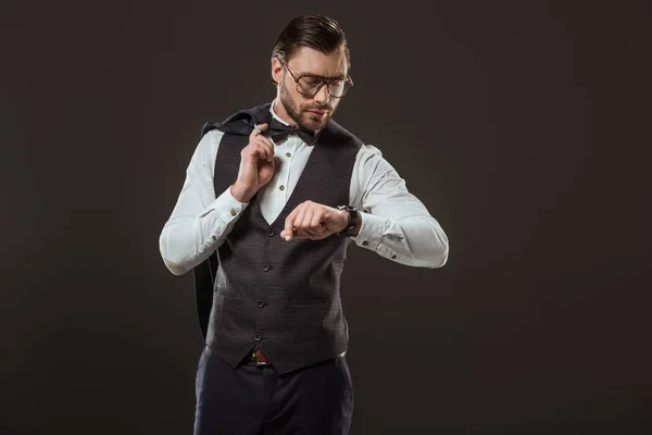 Stylish Businessman Bow Tie Eyeglasses Holding Suit Jacket Checking Wristwatch — Free Stock Photo