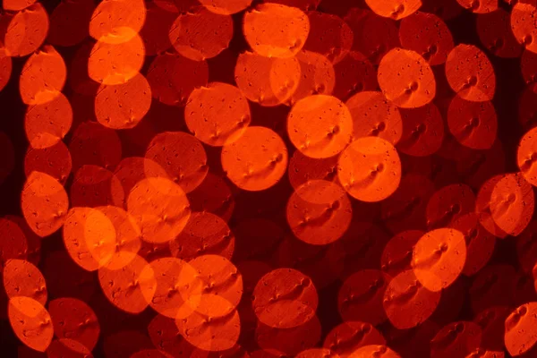 背景のボケ味の美しい光沢のある赤色のライト — ストック写真