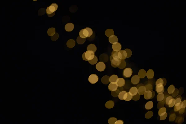 Gyönyörű Golden Fényes Defocused Bokeh Fekete Háttér — Stock Fotó