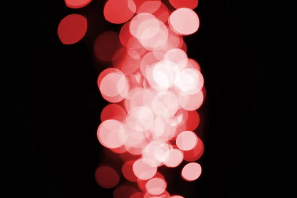 Hermoso Bokeh Rojo Desenfocado Brillante Sobre Fondo Negro — Foto de stock gratuita