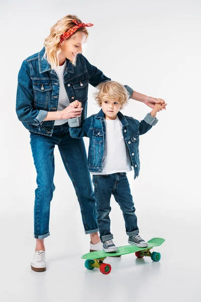 Mother Helping Son Standing Skateboard White — Stock Photo, Image