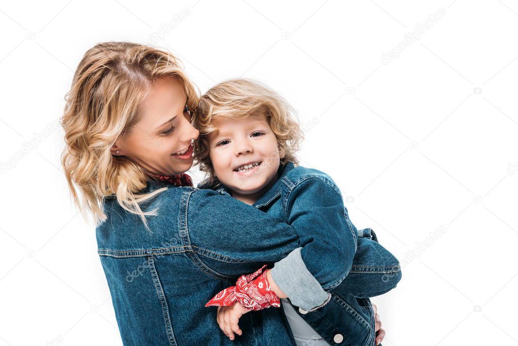 happy mother and son hugging isolated on white