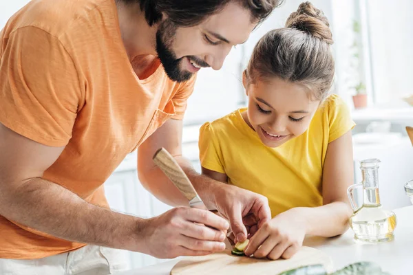 Father Daughter Carving Cucumber While Cooking Home Together — Stock Photo, Image