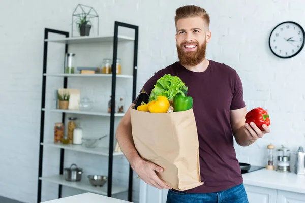 Handsome Smiling Young Man Holding Grocery Bag Fresh Vegetables Kitchen — Stock Photo, Image