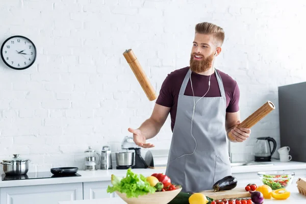 Handsome Smiling Bearded Man Apron Listening Music Earphones While Cooking — Stock Photo, Image