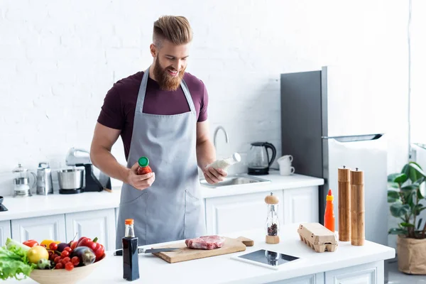 Handsome Smiling Bearded Man Apron Cooking Delicious Steak Kitchen — Stock Photo, Image