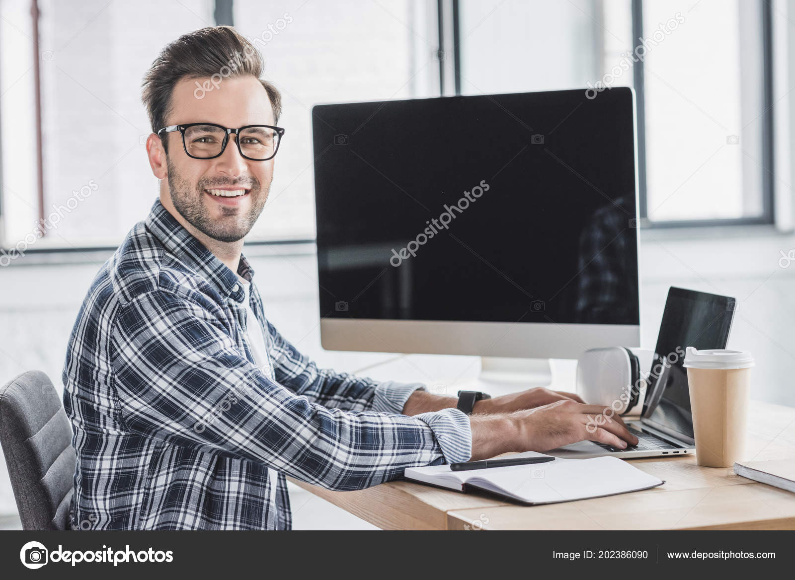 Handsome Young Programmer Eyeglasses Smiling Camera While Working Laptop Desktop ⬇ Stock Photo, Image by © EdZbarzhyvetsky #202386090
