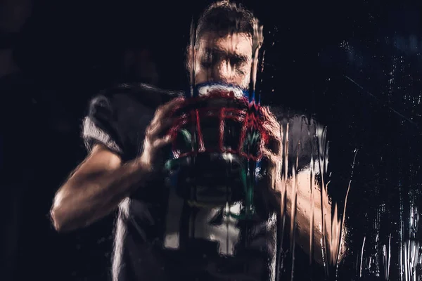 View American Football Player Holding Helmet Black Wet Glass — Stock Photo, Image