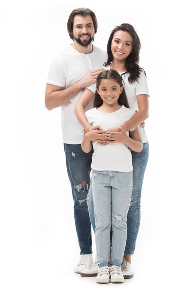 happy family in white shirts and jeans isolated on white