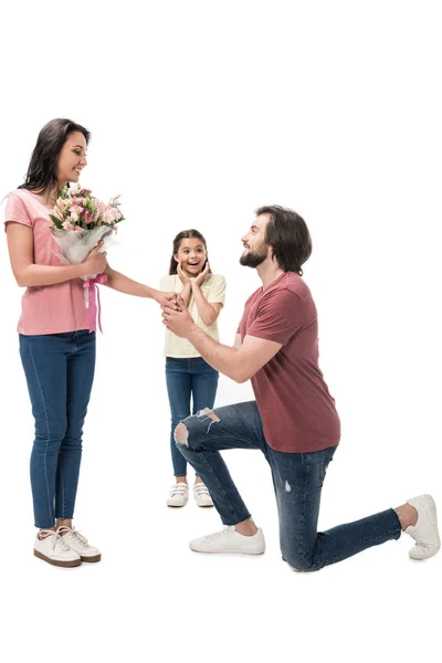 Excited Kid Looking Smiling Woman Bouquet Flowers Man Standing One — Free Stock Photo