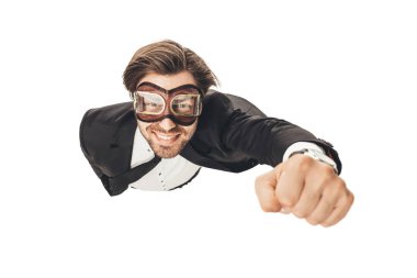 handsome young businessman in vintage aviation goggles flying like superhero isolated on white clipart
