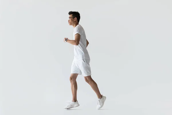 Side View Young Asian Sportsman Running Grey Background — Stock Photo, Image