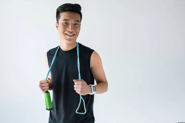 Sorrindo Asiático Desportista Com Smartwatch Segurando Salto Corda Isolado Cinza — Fotografia de Stock