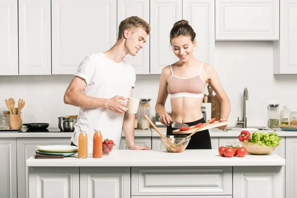 Girlfriend Putting Tomatoes Salad Glass Bowl Kitchen — Stock Photo, Image