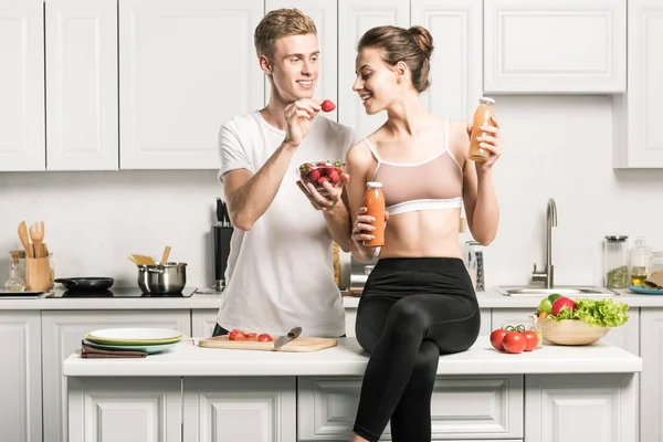Boyfriend Feeding Girlfriend Organic Strawberries Kitchen — Stock Photo, Image