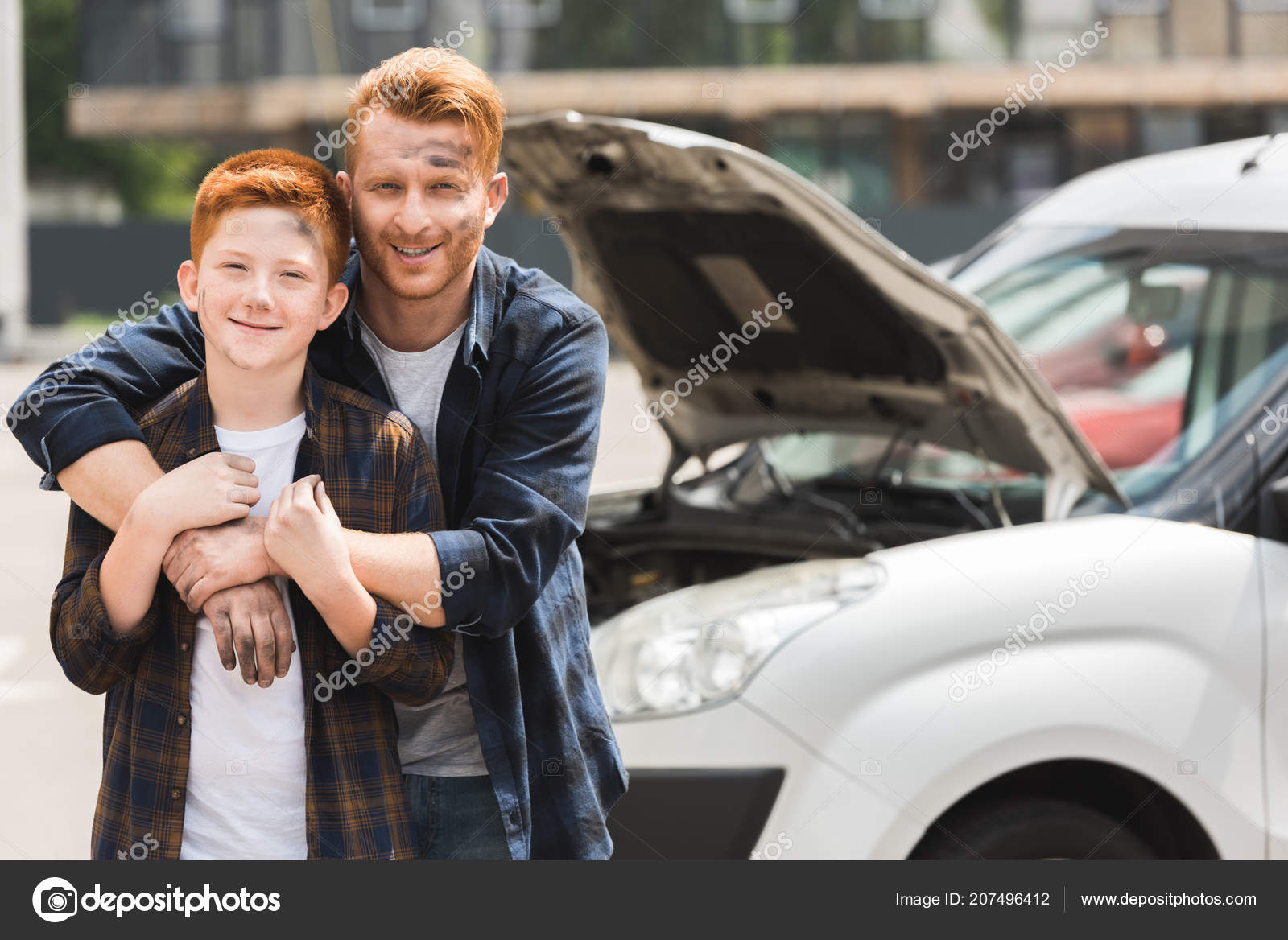 Happy Father Hugging Son Repairing Car — Stock Photo © EdZbarzhyvetsky