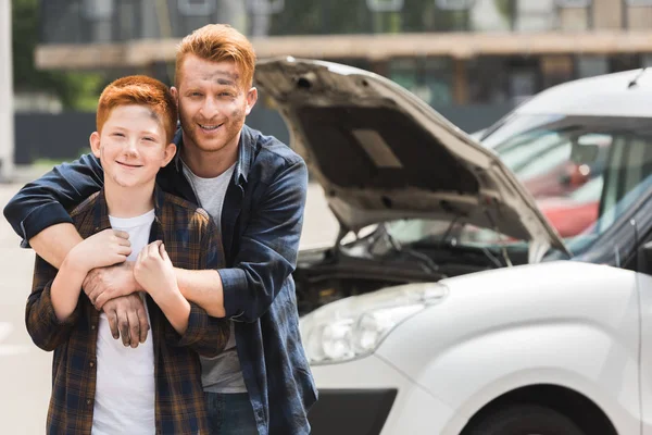 Happy Father Hugging Son Repairing Car — Stock Photo, Image