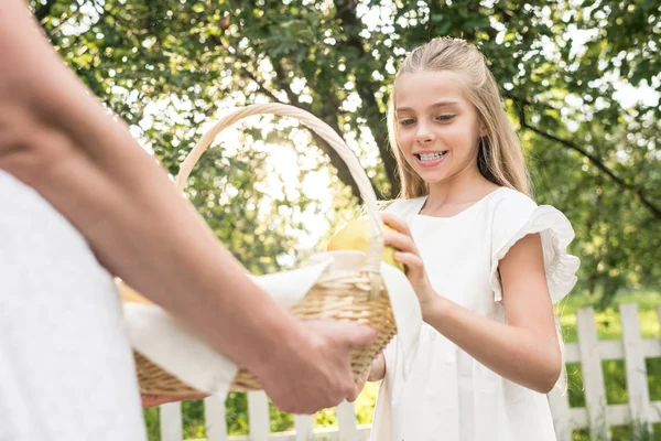 Mother Cheerful Daughter Holding Wicker Basket Fruits — Stock Photo, Image