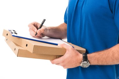 cropped shot of delivery man holding boxes with pizza writing on clipboard isolated on white  clipart