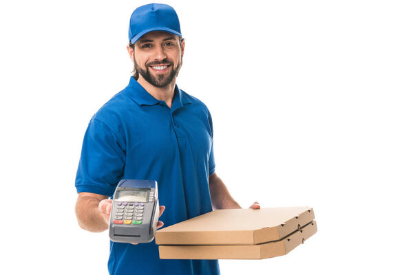 happy delivery man holding boxes with pizza and payment terminal isolated on white