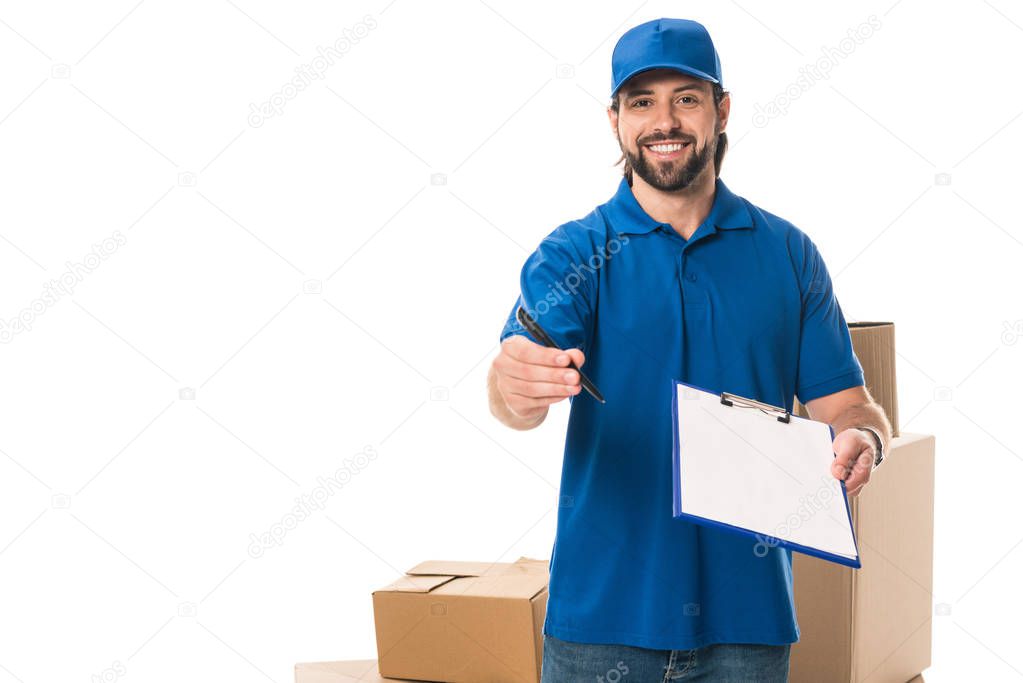 handsome young delivery man holding clipboard and smiling at camera isolated on white 