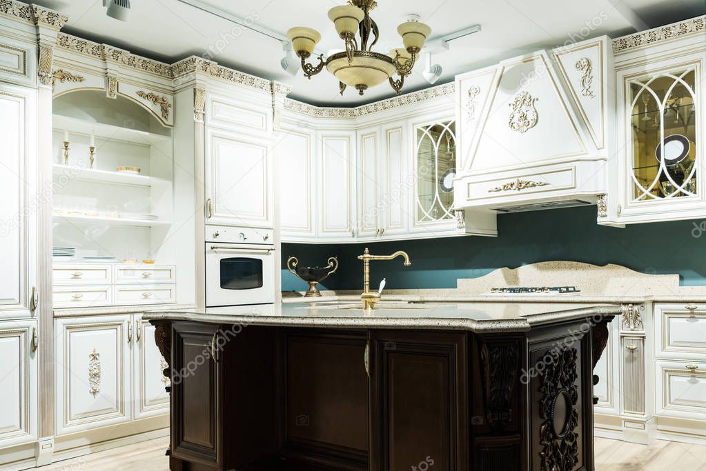 interior of modern kitchen with comfortable wooden furniture in baroque style