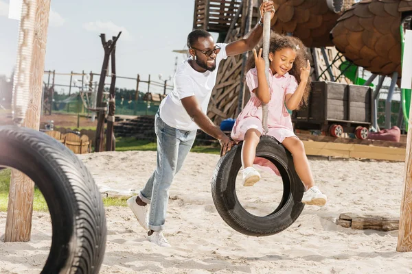 African American Father Daughter Tire Swing Having Fun Playground — Stock Photo, Image