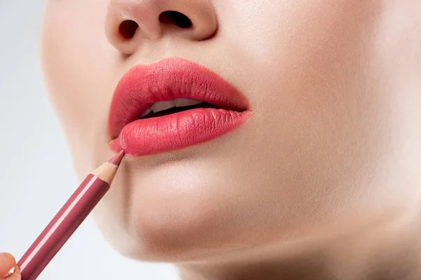 Close Studio Shot Woman Applying Lip Pencil Isolated White — Stock Photo, Image