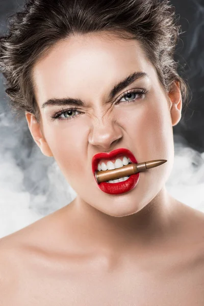 Beautiful Woman Holding Bullet Teeth Grey Smoke — Stock Photo, Image