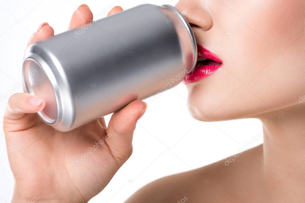 cropped view of girl drinking soda from can, isolated on white
