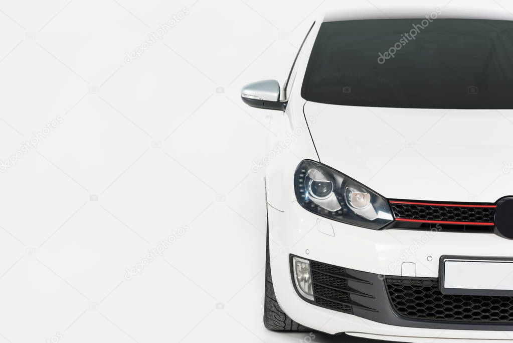 cropped image of one new white automobile on white
