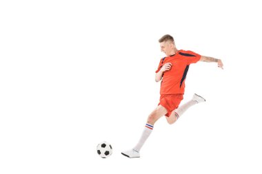 full length view of young sportsman playing soccer isolated on white clipart